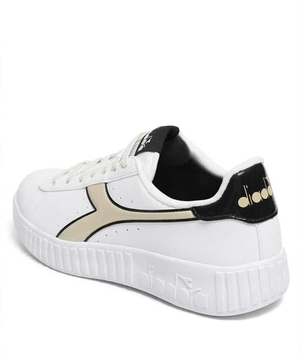 Sneakers Diadora bianche con dettagli beige e neri