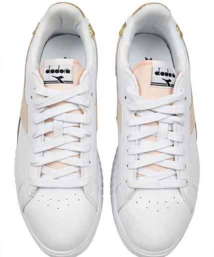 Sneakers Diadora bianche con dettagli dorati iridescenti