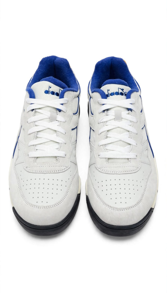Sneaker Diadora Bianca con Profili Blu e Dettaglio Giallo